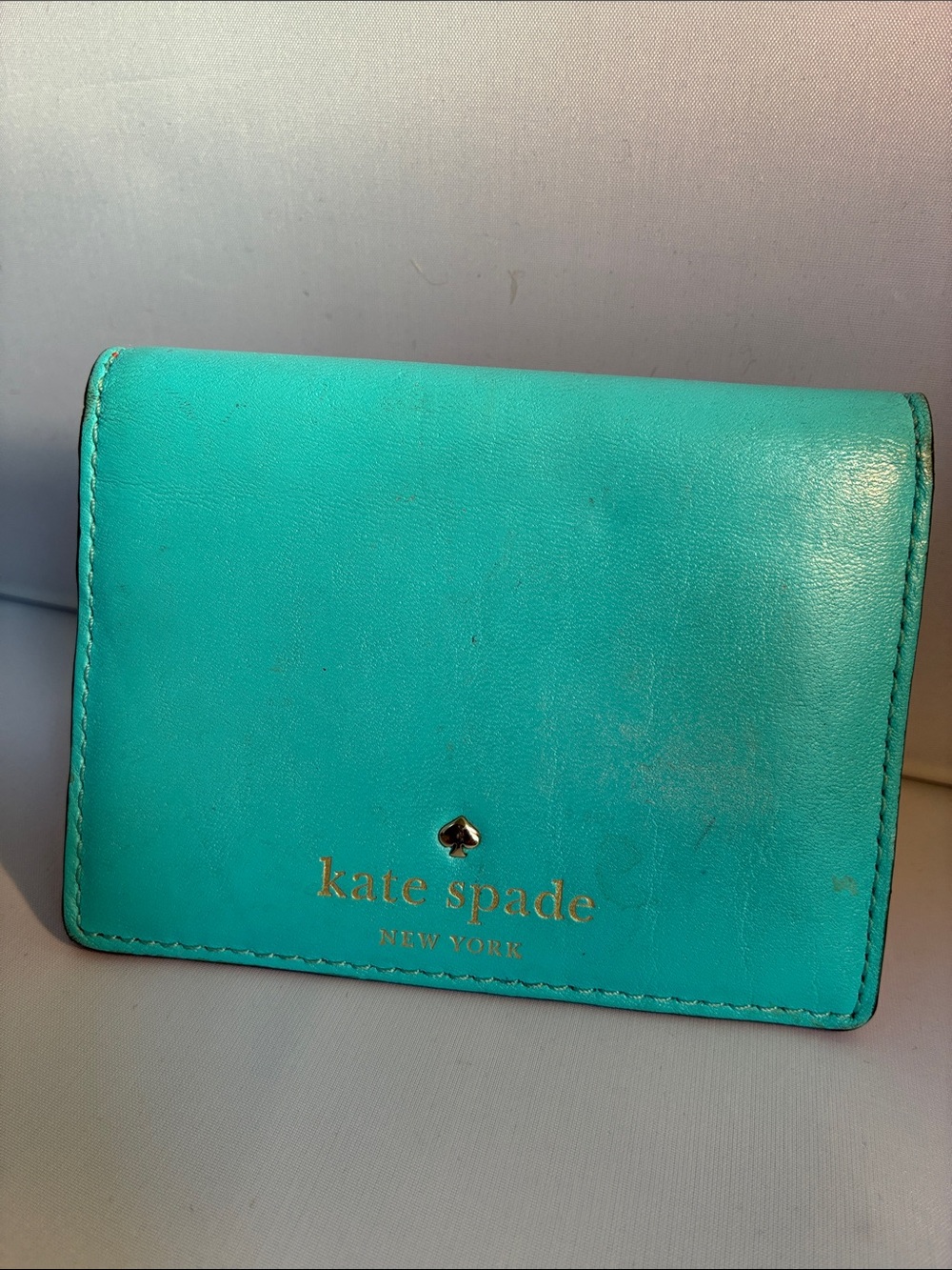 kate spade turquoise leather bifold wallet with gold logo